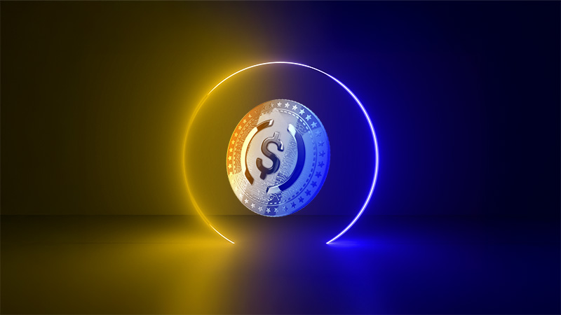 Floating blue and yellow stablecoin coin.