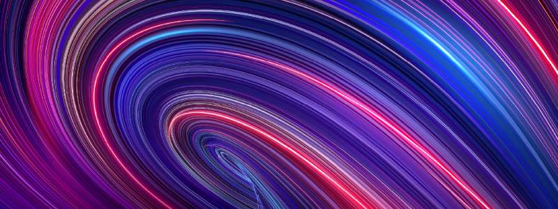 Abstract image of swirling light trails in shades of purple, blue, and pink. 