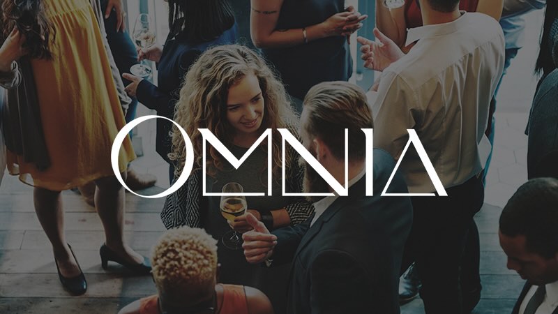 Omnia restaurant logo on top of an image of people socializing