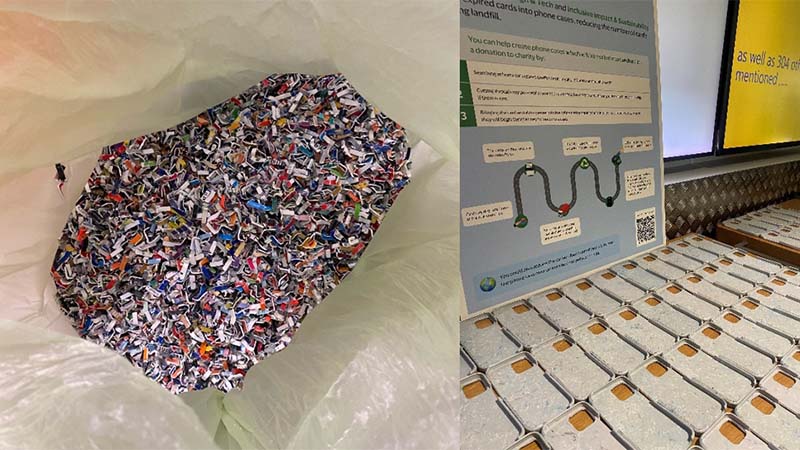 A bag filled with shredded credit cards are displayed next to several phone cases and an informational poster