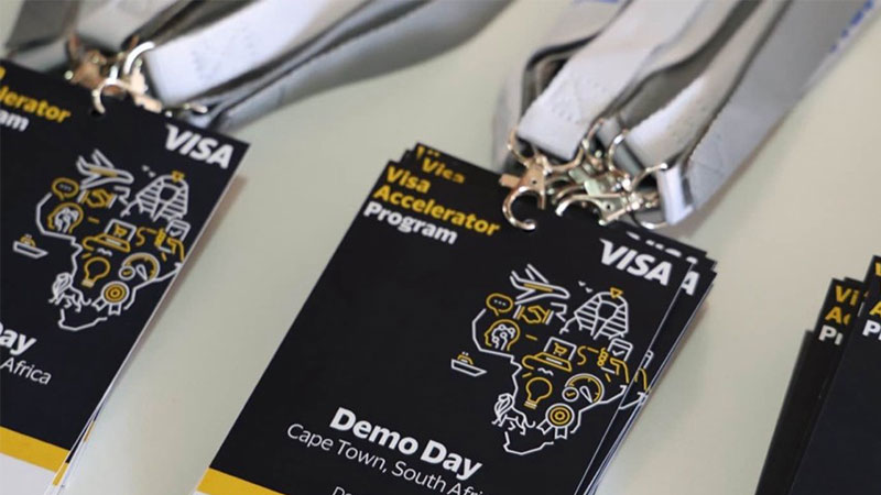 Lanyards with Visa Accelerator Program badges for Demo Day in Cape Town, South Africa, featuring stylized graphic elements and event details.